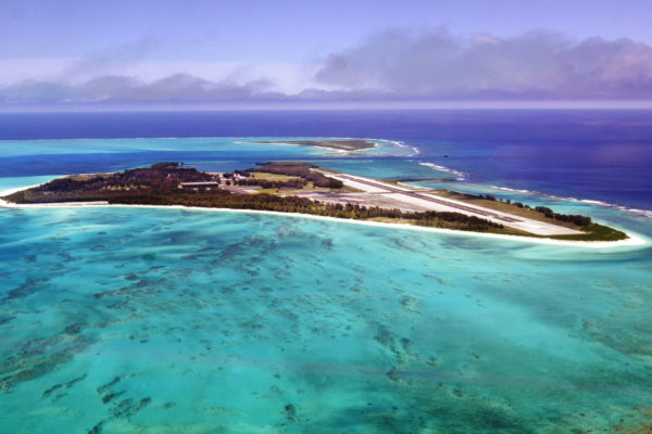 *** FILE *** An aerial view of the 2.5 square mile Midway Atoll is shown June 5, 2002. A proposal, posted on the U.S. Fish and Wildlife Service Web site Friday Dec. 8, 2006, would enable the public to see firsthand the pristine collection of largely uninhabited islands and coral reef colonies that President Bush declared a national marine monument in June.Next year, the plan's first year of operation, Midway Atoll could host as many as 30 visitors each night. (AP Photo/Ronen Zilberman)